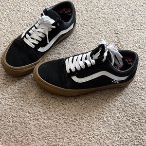 Black and white Vans with gum sole